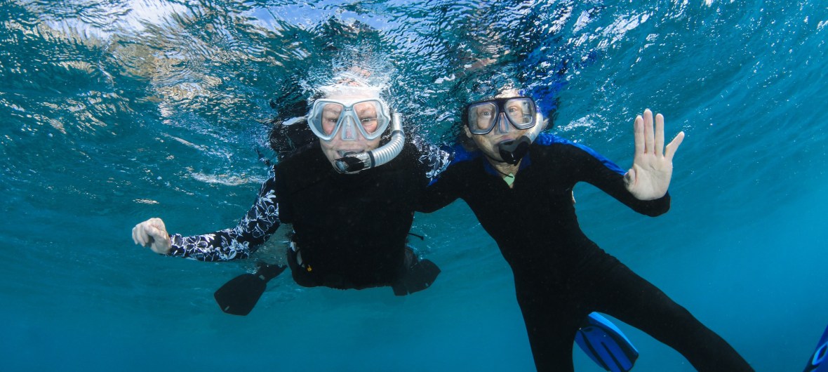 two divers floating in the water, waving - with Blue North Scuba Club, Toronto